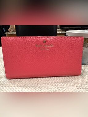 kate spade pink pebbled leather continental wallet with gold logo